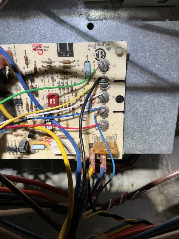 Responded to no cooling call where AC unit would not power on and fan was inoperative. Upon inspection, discovered issue was related to water heater rather than air conditioning system. Examined A.O. Smith 40-gallon natural gas water heater, model G6-S4040NVR 400, serial number 2322134326809. Inspected control board and found evidence of heat damage and component failure with visible burn marks and discoloration on circuit board. Documented equipment specifications and electrical damage with photos. Unit requires control board replacement to restore proper operation.