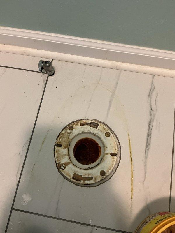 Completed toilet replacement in bathroom. Removed existing toilet and assessed heavily corroded toilet flange showing significant rust damage around mounting surface and connection points. Replaced corroded flange with new assembly to ensure proper seal and secure mounting. Installed new toilet unit, connected water supply line, and tested for proper operation and leaks. Verified flush mechanism functionality and confirmed stable mounting with no movement or rocking. All connections sealed properly with no water leakage detected.