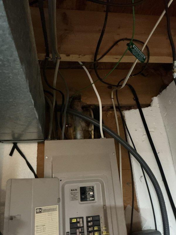 Conducted on-site evaluation for furnace replacement estimate in single-family residence with approximately 20-year-old heating system. Inspected existing electrical panel and circuit breaker configuration to assess compatibility and capacity for new furnace installation. Documented electrical infrastructure, including main breaker panel with labeled circuits and available spaces for potential electrical modifications required for equipment upgrade.