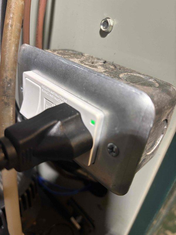 Completed inspection correction by installing GFCI outlet in basement for condensate pump equipment as required by code. Replaced standard electrical outlet with proper GFCI protection to ensure safe operation of HVAC condensate removal system and bring installation into compliance with electrical safety requirements.
