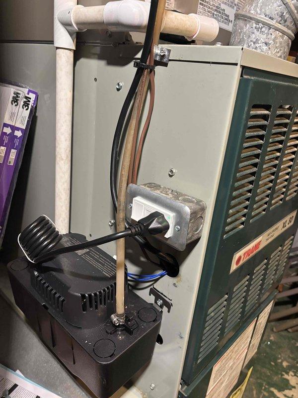 Completed inspection correction by installing GFCI outlet in basement for condensate pump equipment as required by code. Replaced standard electrical outlet with proper GFCI protection to ensure safe operation of HVAC condensate removal system and bring installation into compliance with electrical safety requirements.