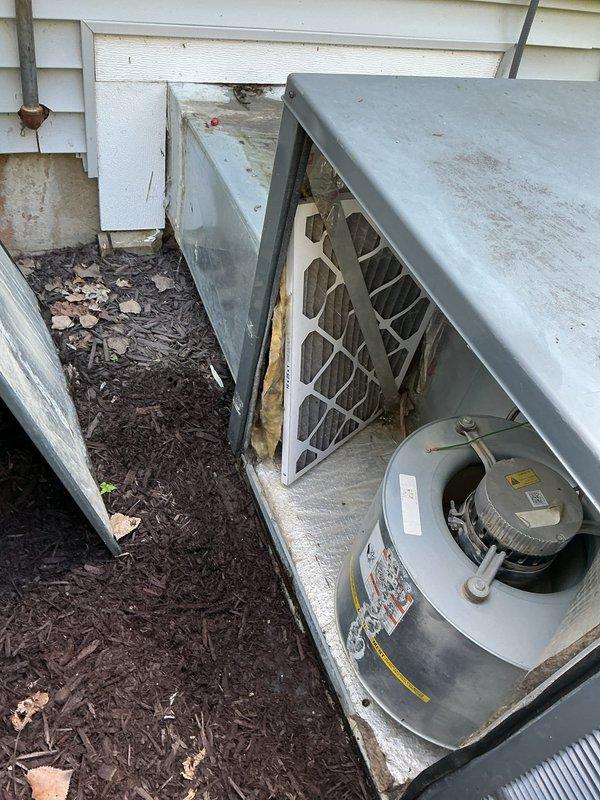 Completed annual heating and cooling maintenance on 7-year-old package unit located at rear of property. Performed comprehensive system inspection revealing significant rust and corrosion on internal components, particularly around electrical connections and housing panels. Demonstrated proper filter replacement procedure to homeowner per request, including location access via patio door, and provided recommendations for correct filter size and type for future maintenance. All routine tune-up procedures completed, system operating within normal parameters despite visible aging and weathering of exterior components.