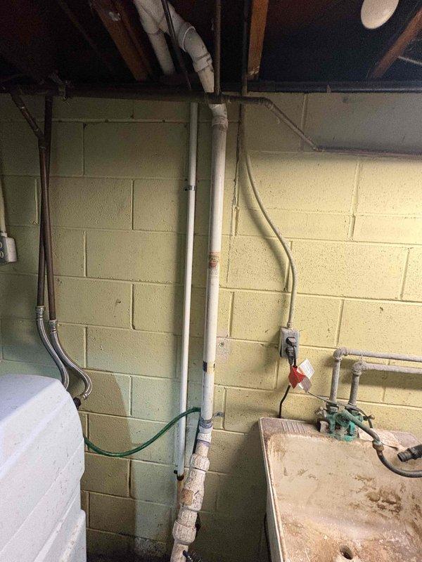 Responded to water softener displaying E3 error code. Inspected unit and plumbing connections in basement utility area, diagnosed electronic control malfunction, and resolved error condition to restore proper water softening operation.