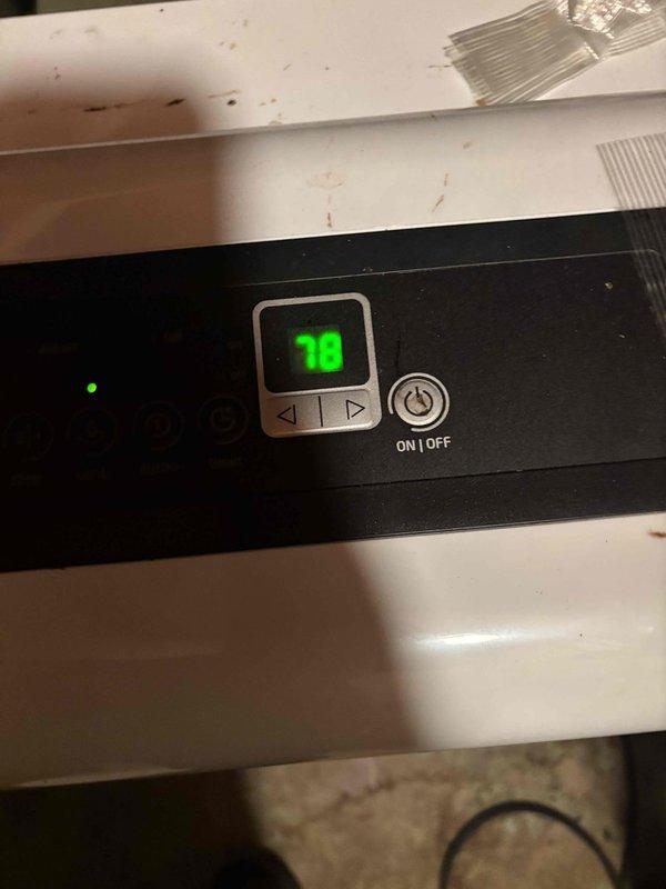 Responded to callback for elevated humidity levels reaching 75% following previous service visit. Upon arrival, discovered humidifier control set to 18% but system malfunctioning, causing excessive moisture output. Basement inspection revealed standing water on concrete floor resulting from humidifier overflow condition. Adjusted humidifier settings and verified proper operation of control panel and solenoid valve. Addressed water accumulation issue and confirmed system now maintaining appropriate humidity levels. Customer equipment covered under extended warranty plan. Documented conditions with photos of control panel display and basement water damage for warranty records.