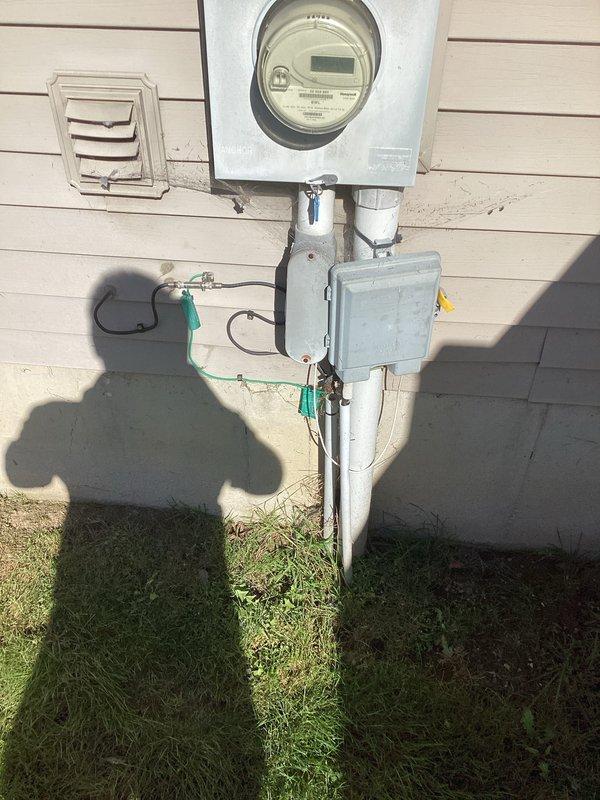 Conducted site assessment for whole house generator installation at residential property with 2019 electrical system. Documented existing electrical service entrance configuration including meter mounting, service panel location, and current electrical infrastructure. Evaluated exterior utility installation with weatherproof components and interior main electrical panel to determine optimal generator placement, required transfer switch specifications, and necessary electrical modifications for seamless integration with existing system.