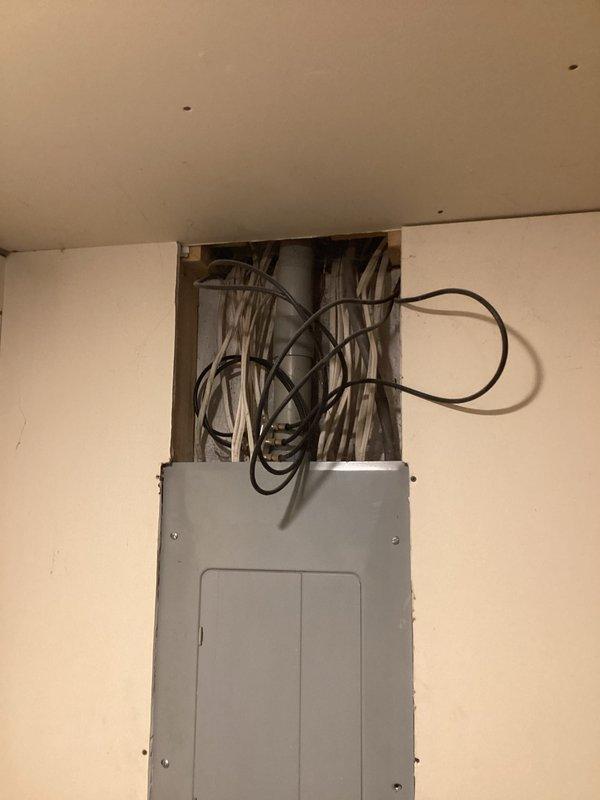 Conducted site assessment for whole house generator installation at residential property with 2019 electrical system. Documented existing electrical service entrance configuration including meter mounting, service panel location, and current electrical infrastructure. Evaluated exterior utility installation with weatherproof components and interior main electrical panel to determine optimal generator placement, required transfer switch specifications, and necessary electrical modifications for seamless integration with existing system.