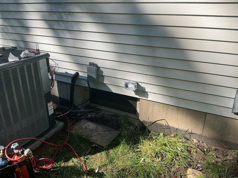 Completed full air conditioning system replacement including outdoor condenser unit and indoor air handler. Installed new condenser on exterior concrete pad with proper electrical disconnect box and refrigerant line connections. Mounted new air handler in basement mechanical room alongside existing furnace, with all necessary condensate drainage piping and electrical connections properly configured per manufacturer specifications. System tested and verified operational.