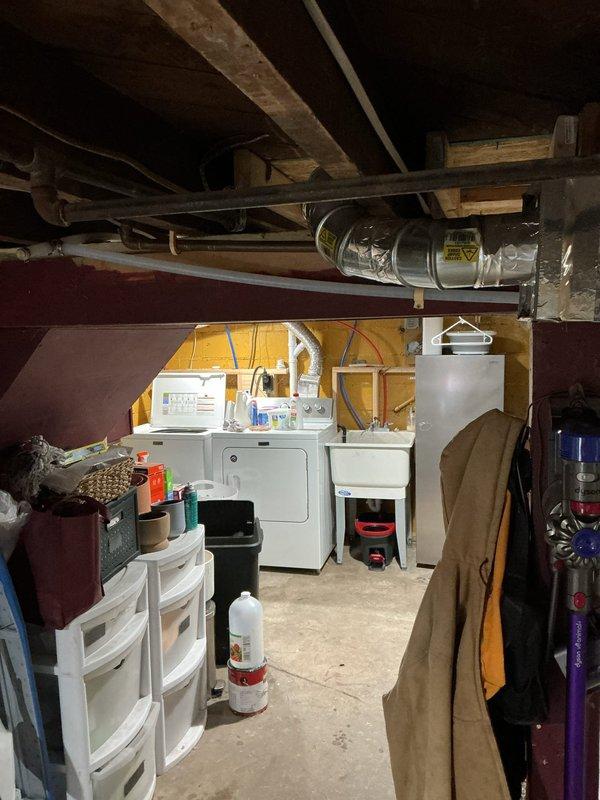 Completed installation of a 40-gallon natural gas Bradford White water heater in basement utility area. Unit was properly vented with metallic ductwork, connected to copper supply lines, and equipped with a blue expansion tank with brass fittings to protect the system from thermal expansion. All connections were secured, safety labels verified, and the installation meets code requirements for residential water heating systems.