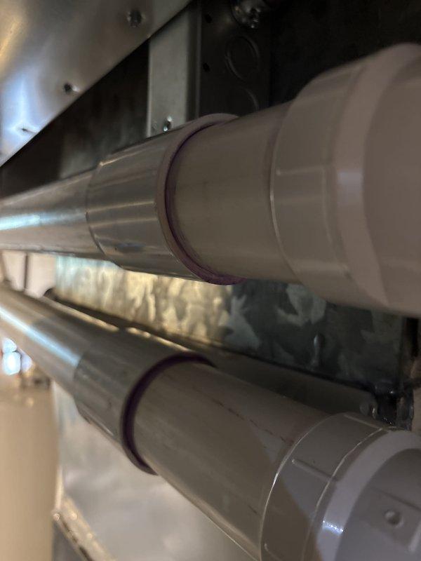 Responded to inspection correction notice regarding furnace venting that failed to meet code section 503.4.1.1 requirements for contrasting color primer on plastic pipe connections. Removed existing white PVC vent piping and reinstalled furnace venting system with proper purple primer application visible at all glued joints to ensure code compliance. Scheduled reinspection upon completion of corrective work.