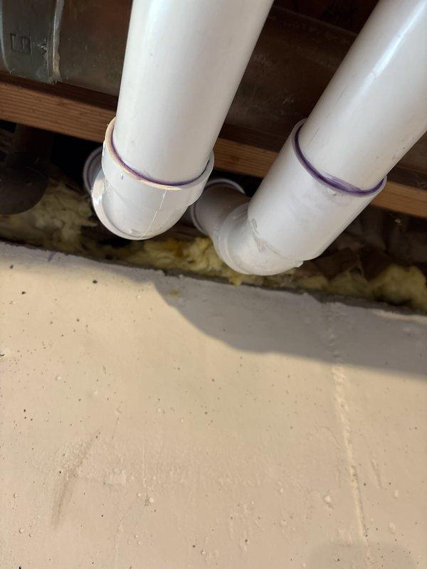 Responded to inspection correction notice regarding furnace venting that failed to meet code section 503.4.1.1 requirements for contrasting color primer on plastic pipe connections. Removed existing white PVC vent piping and reinstalled furnace venting system with proper purple primer application visible at all glued joints to ensure code compliance. Scheduled reinspection upon completion of corrective work.