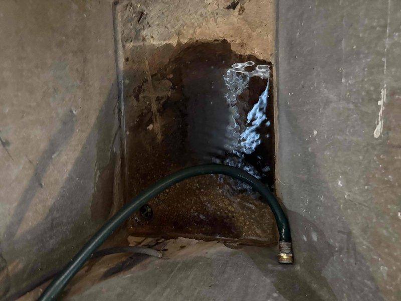 Responded to customer complaint of banging noises from tank-style water heater in basement of single-family residence. Performed complete water heater tune-up service including full tank flush to remove sediment buildup, which was the source of the reported noise. Inspected all plumbing connections, supply lines, and venting components for proper operation and safety. Unit operational and functioning quietly upon completion of service.