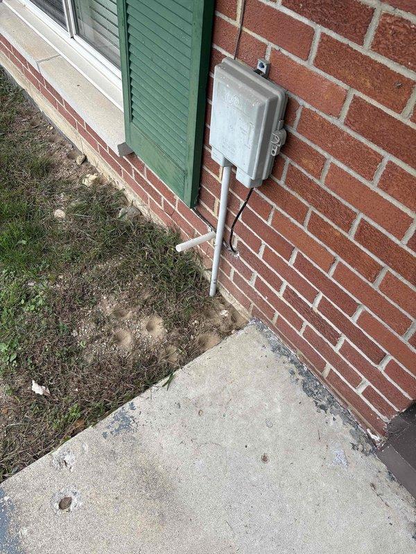 Responded to service call for sump pump that was continuously running. Upon inspection, found sump pit with visible water staining and moisture around the basin area, indicating frequent cycling or discharge issues. Evaluated sump pump operation, checked float switch mechanism, and assessed discharge line routing from basement to exterior-mounted junction box. Resolved running condition by addressing float switch positioning and verified proper pump cycling and automatic shut-off functionality.