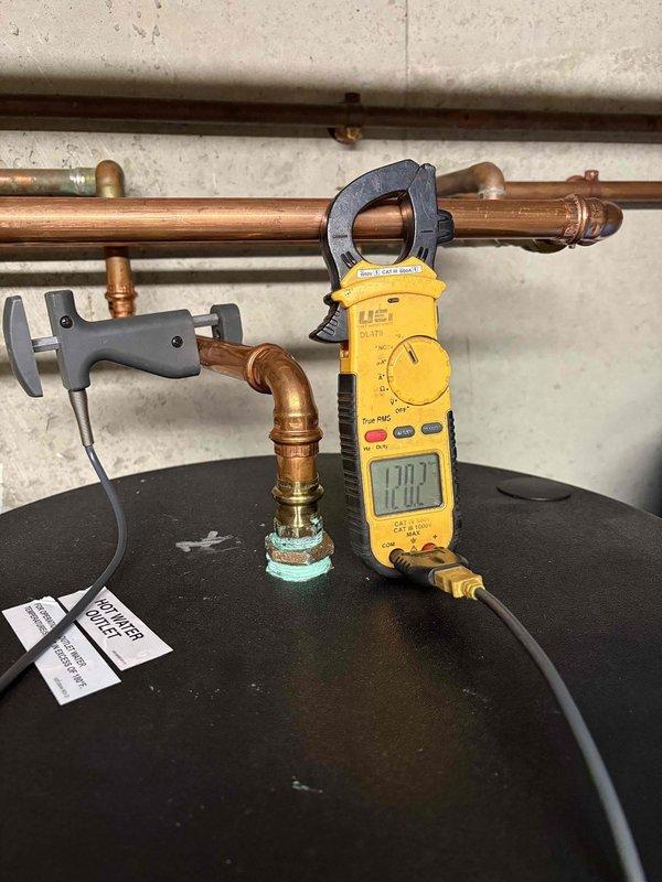 Responded to no-heat call on 39-year-old Slant Fin boiler with red indicator light illuminated. Upon arrival, performed diagnostic testing of the hydronic heating system and electrical components using clamp meter, which indicated power supply issues. Inspected boiler control board, circulator pumps, and associated zone valves on the copper manifold distribution system. Identified failed control component causing system lockout. Replaced defective part, reset boiler controls, verified proper amp draw, and confirmed system returned to normal operation with all zones functioning correctly.
