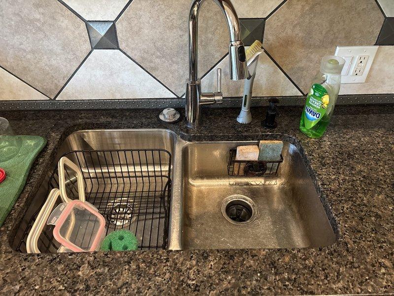 Returned to property to complete previously quoted garbage disposal replacement. Removed existing disposal unit and installed new unit beneath kitchen sink, connecting to existing drain assembly and plumbing infrastructure. Verified proper operation of new disposal, tested for leaks at all connection points, and confirmed secure mounting to sink flange. Work completed within estimated 2-hour timeframe with customer present on-site.
