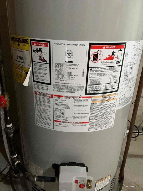 Completed installation of 75-gallon natural gas power vent water heater in basement utility area. Unit was positioned adjacent to existing water softener system, with proper venting installed through metal ductwork, blue expansion tank mounted to supply piping, and all connections made per manufacturer specifications using copper and PVC piping with appropriate gas valve assembly and electrical hookup.