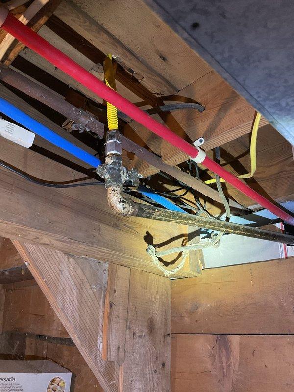 Installed gas shut-off valve on existing gas supply line serving kitchen stove. Work completed in accordance with local plumbing codes to provide proper isolation capability for the appliance.