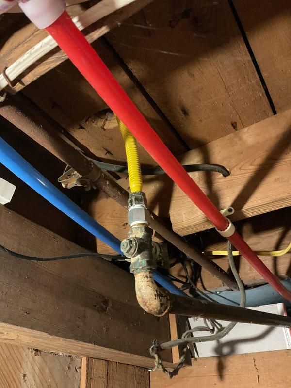 Installed gas shut-off valve on existing gas supply line serving kitchen stove. Work completed in accordance with local plumbing codes to provide proper isolation capability for the appliance.
