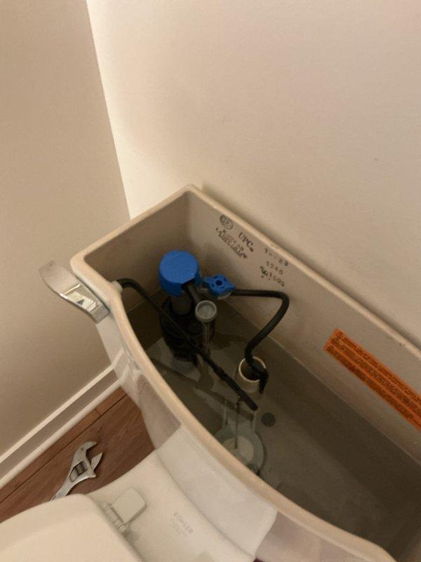 Responded to service call for constantly running toilet in small bathroom. Upon arrival, confirmed toilet was running continuously and water supply shutoff valve beneath the toilet would not fully close, preventing customer from stopping water flow. Inspected toilet tank components and identified faulty fill valve causing continuous water flow into tank and overflow tube. Removed tank lid and assessed flush valve assembly and flapper mechanism for additional wear. Replaced defective water supply shutoff valve beneath toilet with new quarter-turn angle stop valve to restore proper water control. Installed new fill valve assembly with refill tube to eliminate constant running condition. Tested all components for proper operation, verified shutoff valve functioned correctly, and confirmed no leaks at supply line connection or within tank. Left toilet in proper working order with no active water flow issues.
