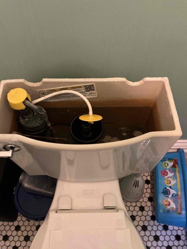 Responded to first floor bathroom toilet issue with cracked internal component. Upon inspection, identified damaged flush valve assembly within tank. Removed defective flush valve mechanism, installed replacement unit, verified proper operation and seal integrity, and confirmed no leaks present after testing multiple flush cycles.
