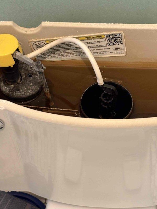 Responded to first floor bathroom toilet issue with cracked internal component. Upon inspection, identified damaged flush valve assembly within tank. Removed defective flush valve mechanism, installed replacement unit, verified proper operation and seal integrity, and confirmed no leaks present after testing multiple flush cycles.