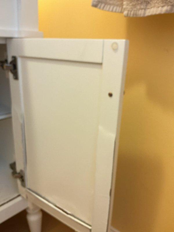 Responded to plumbing leak at vanity cabinet previously installed by company. Upon inspection, identified active leak at supply connections beneath sink. Client reported ongoing dissatisfaction with prior installation work, including damaged vanity cabinet showing mold deterioration requiring future replacement, but requested immediate focus on stopping the leak rather than full vanity removal at this time. Accessed cabinet interior, inspected P-trap assembly, supply lines, and shut-off valve connections. Tightened loose fittings and addressed source of water infiltration to stop active leak. Documented cabinet condition with photos showing plumbing configuration and cabinet interior. Leak successfully stopped as temporary measure until client decides on complete vanity replacement to address underlying mold and structural damage.