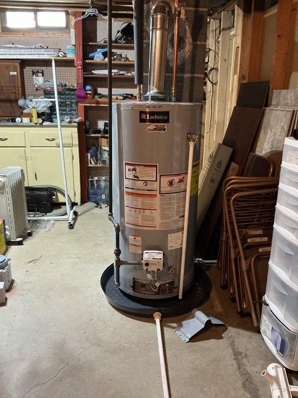 Responded to water heater leak on 3-year-old Lochinvar unit. Upon inspection, identified water leaking from bottom of tank, indicating internal tank failure. Due to age of unit still under typical warranty period, documented condition with photos showing manufacturer label and installation date of 01-22-25. Advised customer of tank failure and recommended contacting manufacturer for potential warranty claim, as internal tank leaks are not repairable and require full unit replacement.