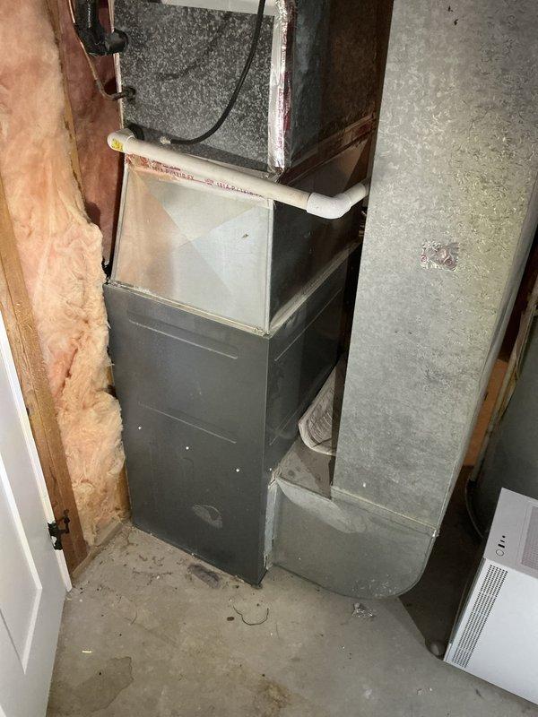 Completed estimate for air conditioning system in residential property. Documented existing HVAC equipment in basement utility room, including furnace unit, air handler, associated ductwork, and plumbing connections. Photographed current system configuration and mechanical room conditions to prepare comprehensive cooling system replacement proposal for tenant-occupied property.