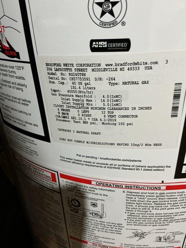 Completed installation of a 40-gallon Bradford White natural gas water heater (Model RG2PV) with natural draft venting in basement utility area. Unit was properly connected to existing copper supply lines, gas line, and venting system, with overflow pan positioned at base per code requirements. All manufacturer specifications were verified, including 40,000 BTU/hr input rating and proper gas pressure settings, and unit was tested for safe operation upon completion.