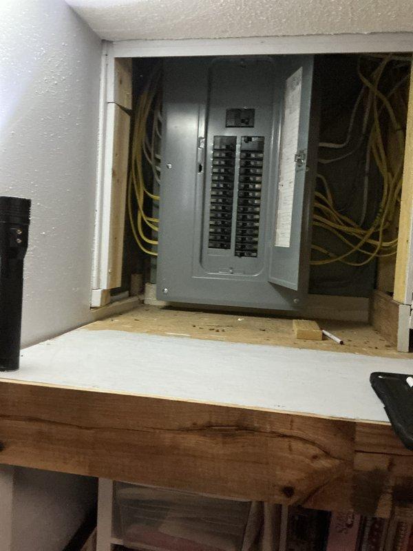 Conducted free on-site generator estimate for residential property with no existing backup power system. Assessed electrical panel configuration and available space for potential generator installation, documenting current 200-amp service panel located in interior utility area with accessible ceiling space above. Photographed electrical infrastructure including main panel box with dual rows of circuit breakers, existing wire routing through wall cavities and ceiling joists, and structural framing to determine optimal placement and connection points for future automatic standby generator system. Comfort advisor to prepare comprehensive quote based on site assessment findings.