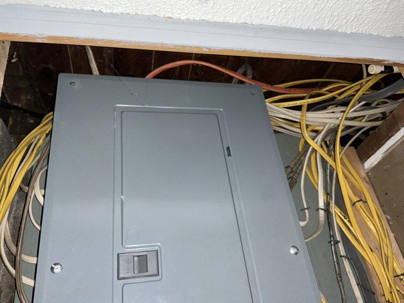 Conducted free on-site generator estimate for residential property with no existing backup power system. Assessed electrical panel configuration and available space for potential generator installation, documenting current 200-amp service panel located in interior utility area with accessible ceiling space above. Photographed electrical infrastructure including main panel box with dual rows of circuit breakers, existing wire routing through wall cavities and ceiling joists, and structural framing to determine optimal placement and connection points for future automatic standby generator system. Comfort advisor to prepare comprehensive quote based on site assessment findings.