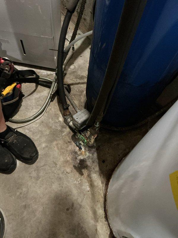 Responded to water pressure complaint following recent water heater installation. Upon inspection, identified issue related to pressure tank system in basement utility area. Verified Champion by Amtrol pressure tank connections, checked valve operation at tank base, and confirmed proper system pressurization to restore adequate water pressure throughout residence.