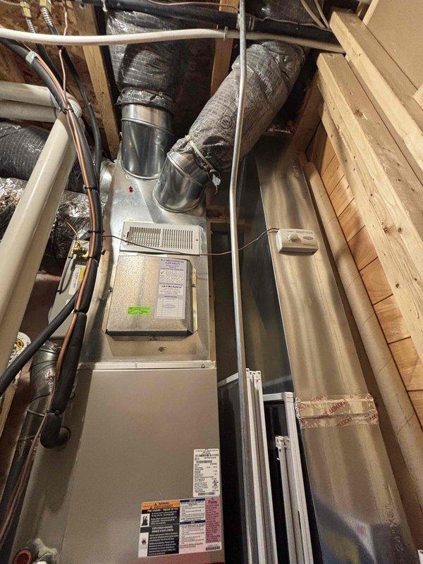 Completed annual heating maintenance on 13-year-old Carrier furnace installed in attic space. Performed comprehensive tune-up including filter inspection, burner assembly cleaning, blower motor lubrication, and safety control verification. All system components operating within manufacturer specifications with no repairs required at this time.