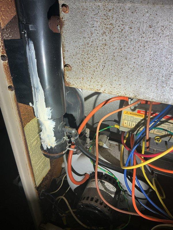 Completed annual heating and cooling maintenance on two systems: a 14-year-old Payne unit and a 31-year-old Lennox system. Performed comprehensive tune-up procedures including inspection of all mechanical components, electrical connections, and refrigerant lines. Observed oxidation on copper refrigerant piping with characteristic patina consistent with system age, along with corrosion and rust staining on mounting brackets and surrounding metal surfaces. Inspected capacitor and electrical connections, noting multiple wire terminations in good working order. Verified proper operation of both heating and cooling systems, checked safety labels and warning placards for visibility and compliance. Documented existing wear patterns and age-related deterioration typical of equipment service life. All systems operational upon completion of annual maintenance visit.