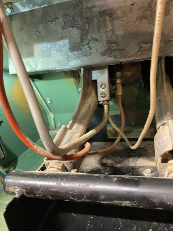 Responded to no heat call for 40-year-old heating unit that would not turn on. Upon inspection, found unit had reached end of serviceable life with heavily discolored heat exchanger showing significant age-related deterioration, corroded copper refrigerant lines, and overall system degradation. Documented equipment condition with photos showing extensive staining on internal components, oxidized piping, and general wear throughout the assembly. Advised customer that unit replacement is necessary due to age and condition of critical components.