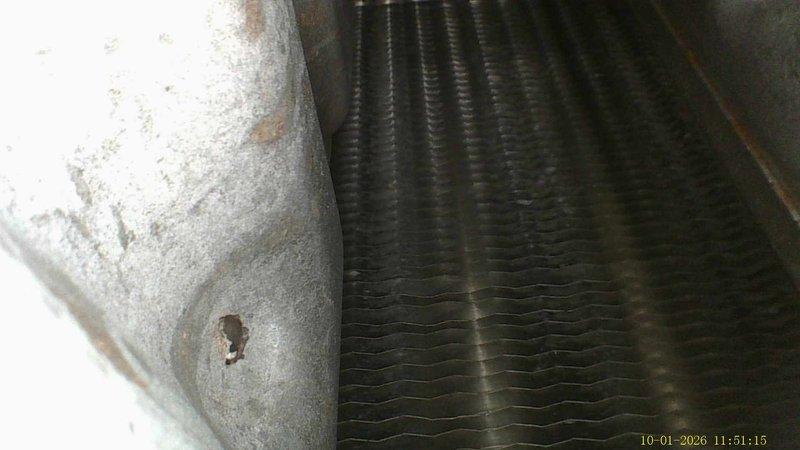 Completed annual heating maintenance on 11-year-old Carrier furnace system with humidifier. Performed comprehensive tune-up including filter inspection, burner assembly cleaning, heat exchanger examination, and safety control testing. Documented significant frost accumulation on refrigerant suction line and evaporator coil area, indicating potential low refrigerant charge, restricted airflow, or metering device malfunction requiring further diagnostic evaluation. Inspected PVC condensate and vent piping showing normal wear and minor surface soiling. All heating components operational at time of service, but recommend scheduling follow-up to address frost condition before cooling season to prevent system inefficiency and potential compressor damage.