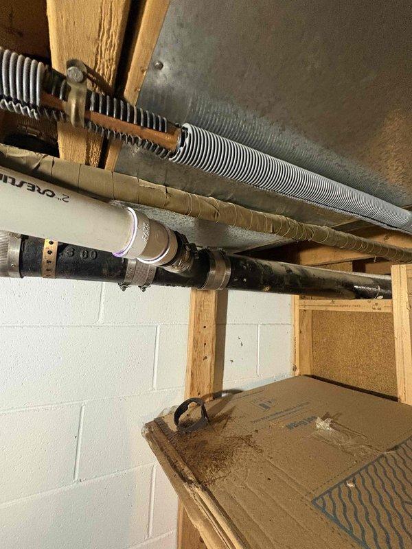 Completed installation of new shower trim kit with replacement valve cartridge and tub drain assembly. Accessed plumbing through existing wall opening, removed old worn components, installed new chrome-finished trim with brass valve stem, and replaced deteriorated tub drain hardware to restore full functionality to the bathing fixture.