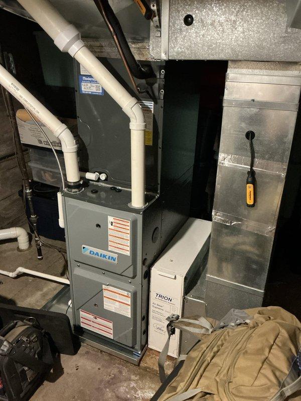 Completed annual heating maintenance on Daikin furnace system and humidifier. Performed comprehensive tune-up including inspection of all components, burner assembly, heat exchanger, blower motor, and electrical connections. Verified proper operation of Trion air filtration system, checked ductwork connections, and confirmed all safety controls functioning within manufacturer specifications. System operating efficiently with no issues identified.
