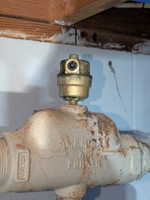 Completed annual heating maintenance on residential boiler system. Performed comprehensive tune-up including inspection of heat exchanger, which showed mineral deposits and discoloration indicating exposure to moisture over time. Examined gas valve assembly, noting significant corrosion and deterioration of painted surfaces with rust present on valve body. All components tested and system confirmed operational. No humidifier present on unit as noted. System cleared for continued service with recommendation for monitoring of corroded valve components.