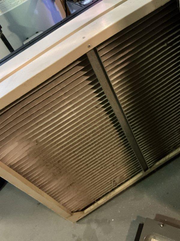 Completed comprehensive 10-year furnace tune-up on EnergiAir system. Inspected and documented condensate pump installation with PVC drainage lines and verified proper operation of all mechanical components. Evaluated air filtration system and noted significant dust accumulation on filters, indicating effective air cleaning performance and proper system operation throughout heating season.