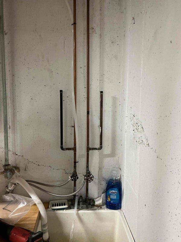 Completed installation of SWS1-45 water softener system in basement utility area. Installation included integration with existing copper supply lines, proper placement of inlet and shut-off valves, and connection to drain system via utility sink. System was pressure tested, programmed for optimal performance, and left fully operational with all components properly secured and labeled.