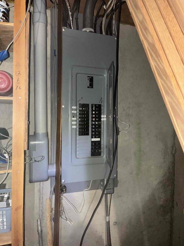 Completed on-site generator installation estimate for residential single-family home. Evaluated existing electrical infrastructure including exterior utility meter mounted on brick wall with digital readout and gray conduit system, as well as interior electrical panel box in basement with dual-column breaker configuration. Assessed electrical service capacity, panel compatibility, and optimal placement for Generac standby generator system. Documented current electrical setup through photographs showing meter base, service entrance conductors, main breaker panel, and available conduit pathways. Reviewed installation requirements including transfer switch placement, gas line accessibility, and proper clearances for generator pad location. Property features long driveway access located near interstate with landmark identification for future installation crew coordination. Provided comprehensive quote covering generator unit specifications, automatic transfer switch, electrical connections