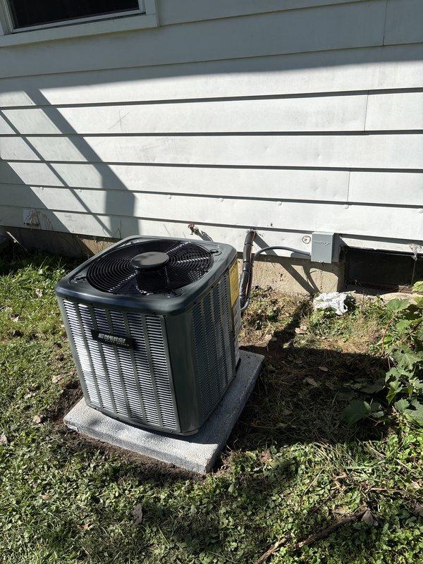 Completed full HVAC system installation including new furnace and air conditioning condensing unit. Installed furnace in basement utility area with proper PVC venting, air filter access compartment, and drip pan placement on concrete floor. Mounted outdoor AC condensing unit on concrete pad against exterior wall with appropriate electrical disconnect and refrigerant line routing through wall penetration. All equipment secured, connected, and operational per manufacturer specifications.