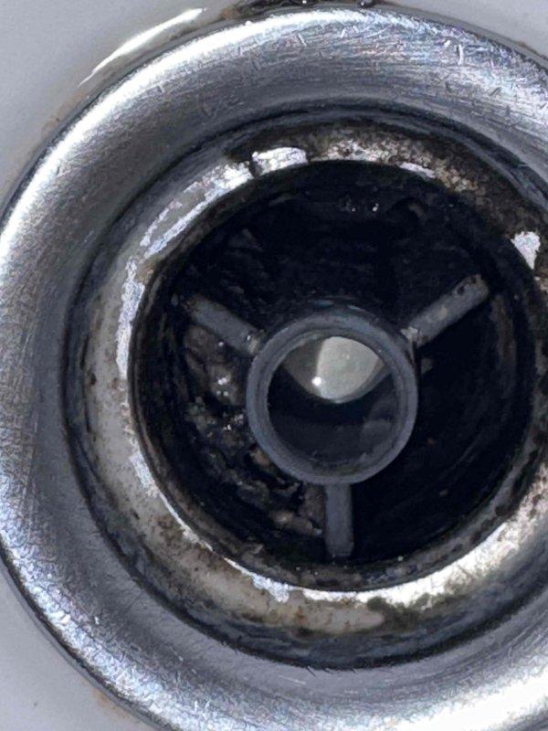 Completed trap cleaning and cartridge replacement as quoted. Removed accumulated buildup and deposits from drain assembly, cleaned stopper mechanism, and serviced P-trap. Replaced worn cartridge components and tested system for proper drainage and operation.