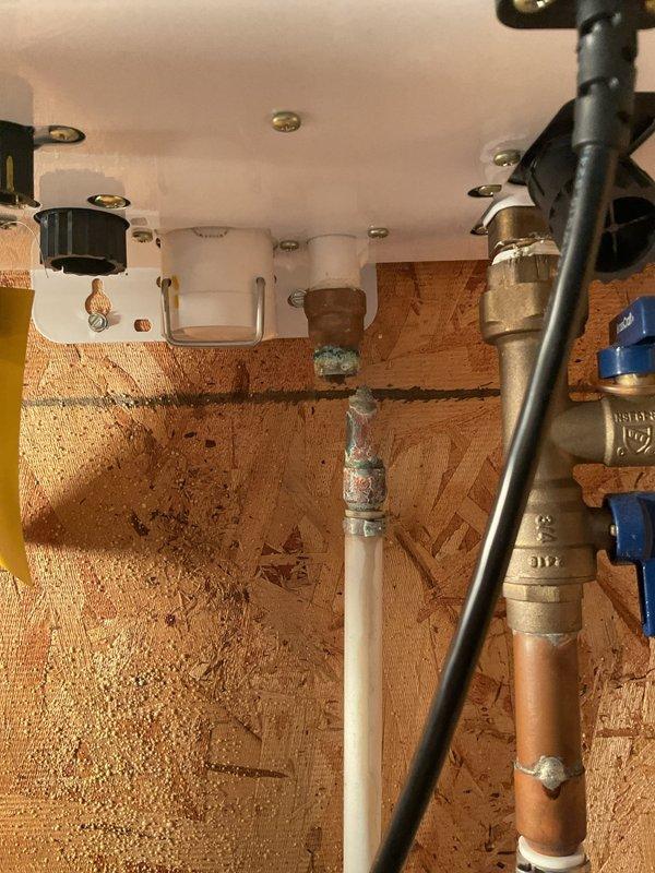Completed tankless water heater tune-up on 7-year-old Navien unit. Replaced leaking copper pipe section beneath the tankless water heater and installed new T-valve for faucet connection as requested. Performed standard maintenance inspection, verified proper operation of all components, and confirmed no active leaks upon completion.
