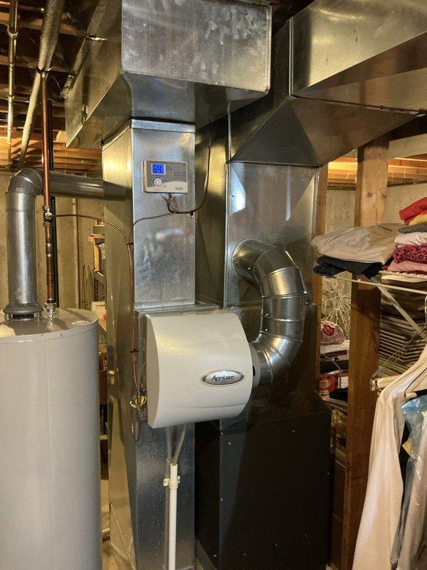 Conducted free estimate visit for furnace replacement on 12-year-old EnergiAir system located in basement. Reviewed and discussed two previously provided estimates from January 2026 for manufacturer warranty furnace replacement and partial warranty heat exchanger replacement options. Documented existing HVAC system including furnace, ApriLaire humidifier, ductwork configuration, and overall mechanical room setup to provide comprehensive replacement recommendations.