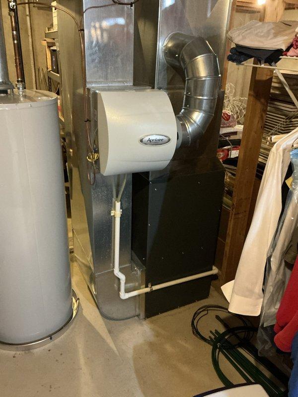 Conducted free estimate visit for furnace replacement on 12-year-old EnergiAir system located in basement. Reviewed and discussed two previously provided estimates from January 2026 for manufacturer warranty furnace replacement and partial warranty heat exchanger replacement options. Documented existing HVAC system including furnace, ApriLaire humidifier, ductwork configuration, and overall mechanical room setup to provide comprehensive replacement recommendations.
