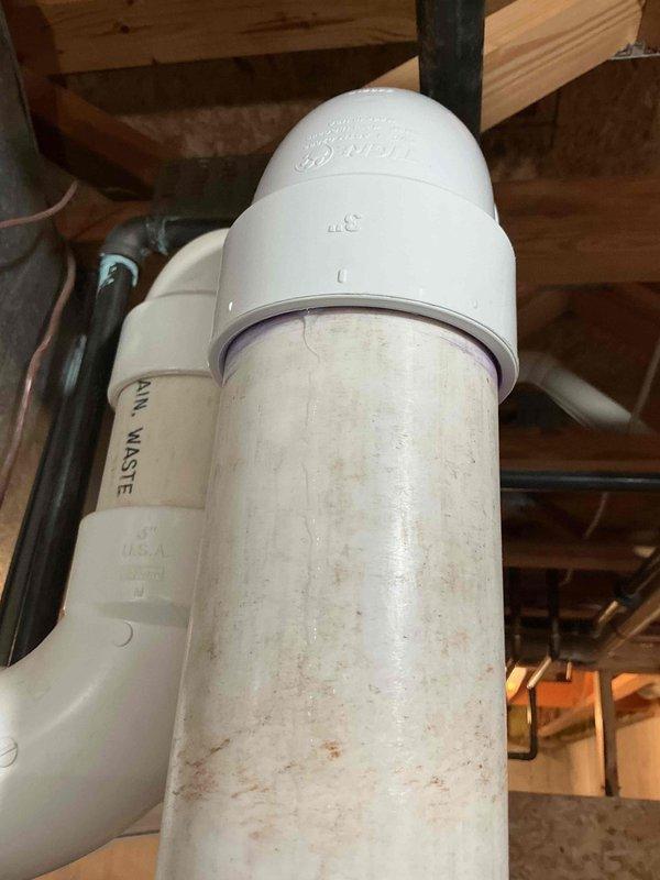 Responded to water leak concern related to furnace condensation on floor. Upon inspection, identified PVC condensate drain piping in basement showing water staining and mineral deposits on exterior surfaces. Verified drainage system components including vertical waste pipes and elbow fittings for proper operation. Documented conditions with photographs showing discoloration on PVC piping and surrounding basement infrastructure. System evaluated to ensure condensate drainage functioning as designed with no immediate concerns requiring repair.