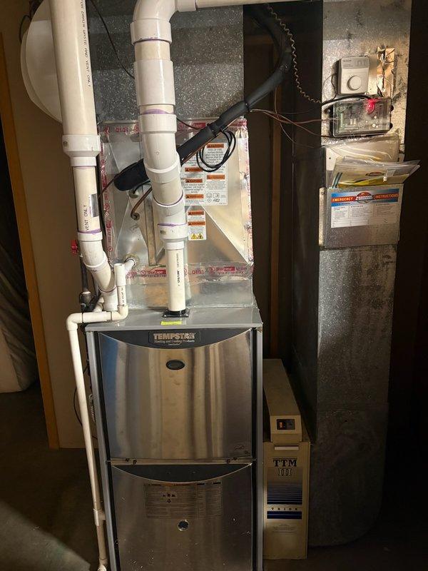 Completed comprehensive furnace super tune-up on Tempstar heating system and Trion TTM III air handler. Performed full system inspection, cleaned and tested all components, verified proper operation of controls and safety devices, and documented equipment condition with photos showing both units in functional order within the mechanical room.