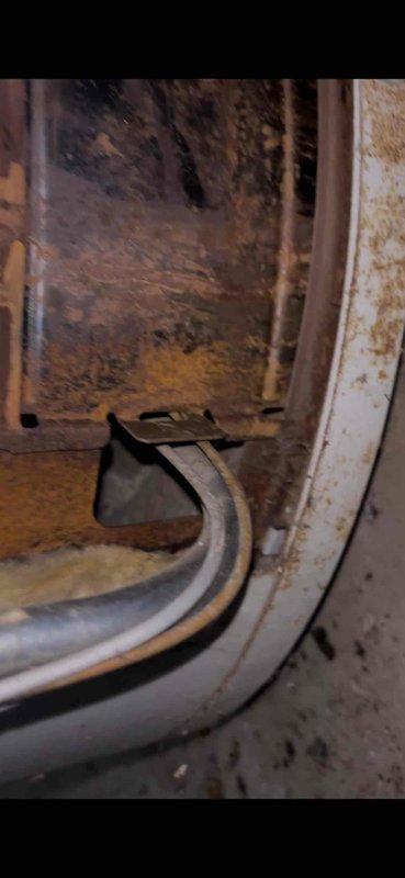 Completed annual heating maintenance and furnace tune-up on approximately 2-year-old system. Unit exhibited significant age-related wear with dust accumulation, interior discoloration, and oxidation on metal components. HydroJet water system showed extensive deterioration with peeling exterior coating and rust damage on top surface, along with visible moisture staining on surrounding floor area.