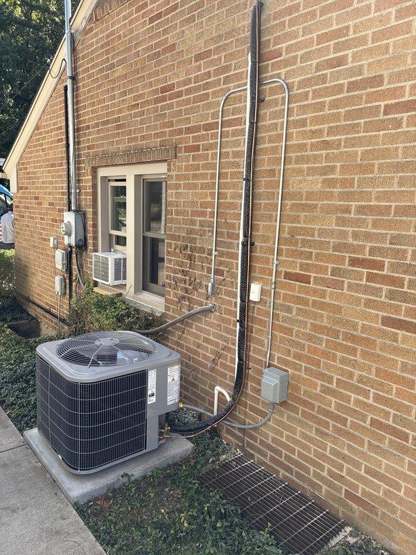 Completed full HVAC system installation including outdoor condensing unit, attic-mounted air handler with ductwork, furnace, and water heater. Installed new refrigerant lines with insulation, electrical conduit and connections, PVC condensate drain piping, and positioned equipment on concrete pad and attic platform per code requirements. All components tested and operational upon completion.